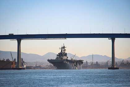 SAN DIEGO (Mar. 5, 2018) The amphibious assault ship USS Essex (LHD 2) transits under the Coronado Bridge on its way to participate in the Navy's first full-length Amphibious Readiness Group (ARG) Surface Warfare Advanced Tactical Training (SWATT) exercise. SWATT is led by the Naval Surface and Mine Warfighting Development Center and is designed to increase warfighting proficiency, lethality, and interoperability of participating units. U.S. Navy photo by Lt. Matthew A. Stroup