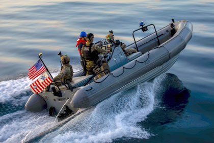 Border Boating: Coast Guardsmen assigned to the Law Enforcement Detachment conduct small boat operations with sailors assigned to the littoral combat ship USS Charleston during a southern border support mission in the Pacific Ocean, May 30, 2025. U.S. Navy photo by Seaman Joey Sitter.