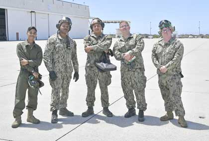 POINT MUGU, Calif. (Aug. 9, 2022) – Sailors assigned to the "Wallbangers" Airborne Command and Control Squadron (VAW) 117, pose for a photo following a seven-month deployment to U.S. 3rd Fleet and 7th Fleet areas of operations with Carrier Air Wing (CVW) 9, embarked aboard USS Abraham Lincoln (CVN 72). CVW-9 deployed with a combination of fourth and fifth-generation platforms that predominantly represent the “Airwing of the Future,” executing more than 21,307 fixed-wing and helicopter flight hours comprising of 10,250 sorties, 8,437 launches and 8,487 aircraft arrestments. U.S. Navy photo by Ens. Drew Verbis.