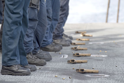 Sailors participate in a small arms gun shoot aboard the aircraft carrier USS Nimitz (CVN 68) in the Pacific Ocean, Feb. 1, 2025. Nimitz is underway in U.S. 3rd Fleet conducting routine training operations. U.S. Navy photo by Mass Communication Specialist Seaman Japeth Carter