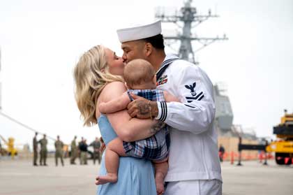 Gas Turbine Systems Technician 2nd Class Dinh Truong, assigned to the Ticonderoga-class guided-missile cruiser USS Princeton (CG 59) shares a first kiss with his spouse after the ship’s return to its homeport of San Diego following a nine-month deployment to the U.S. 5th and 7th Fleet areas of operations, Aug. 13, 2025. An integral part of the U.S. Pacific Fleet, U.S. 3rd Fleet leads naval forces in the Indo-Pacific and provides the realistic, relevant training necessary to execute the U.S. Navy's role across the full spectrum of military operations. U.S. 3rd Fleet works together with allies and partners to advance freedom of navigation and overflight, the rule of law and other principles that underpin security for the Indo-Pacific region. U.S. Navy photo by MC2 Lordin Kelly.